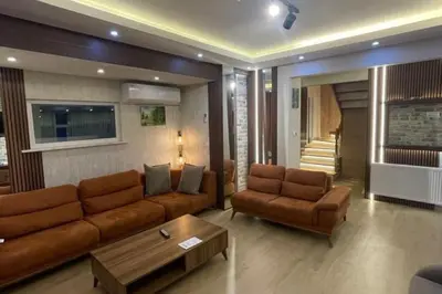 a living room with a couch and a coffee table at Villa 7even By Luxury Group in Buyukcekmece