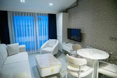 a living room with a couch and a table at Elite World Homes Istanbul Bosphorus in Istanbul