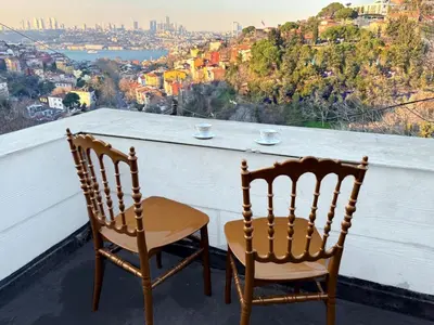 two chairs sitting on a balcony with a view at Heavenly Peace Stunning View Terrace Jacuzzi in Istanbul