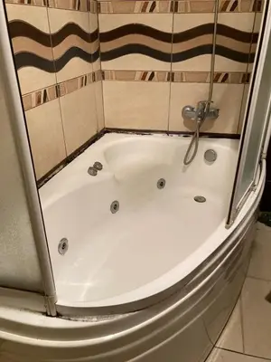 a bath tub with a shower in a bathroom at Heavenly Peace Stunning View Terrace Jacuzzi in Istanbul