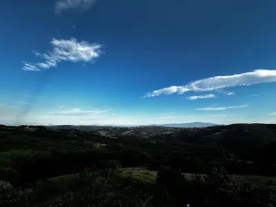 a view of a valley with a blue sky and clouds at Nerry's Garden Izmit - Rose in Yukarı Mecidiye