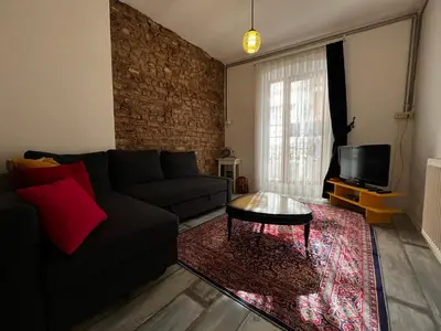 a living room with a couch and a coffee table at Taksim Apartment in Istanbul