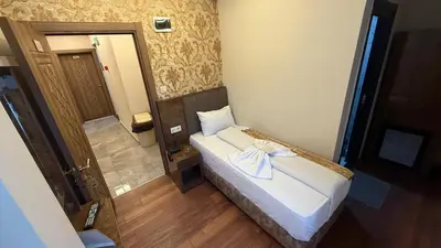 a small room with a bed with a towel on it at Hotel FORTYNİNE in Istanbul