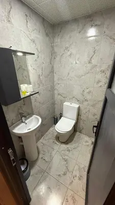a bathroom with a toilet and a sink at Hotel FORTYNİNE in Istanbul