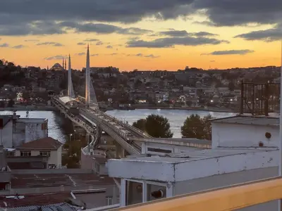a view of a bridge over a river at sunset at Stunning 2BR 3AC Near Metro - YM 3 in Istanbul