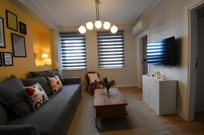 a living room with a couch and a table at Stunning 2BR 3AC Near Metro - YM 3 in Istanbul