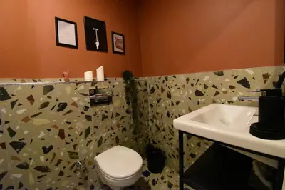 a bathroom with a toilet and a sink at Stunning 2BR 3AC Near Metro - YM 3 in Istanbul