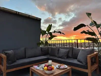 a living room with a couch and a table with fruit at Stunning Seaview 2BR near Metro - YM4 in Istanbul