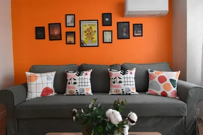 a living room with a gray couch with pillows at Stunning Seaview 2BR near Metro - YM5 in Istanbul