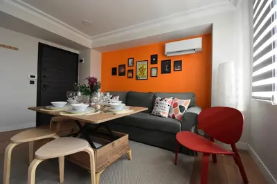 a living room with a table and a couch at Stunning Seaview 2BR near Metro - YM5 in Istanbul