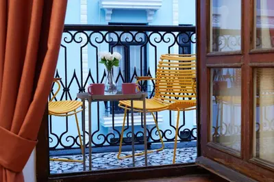 a balcony with a table and chairs on a balcony at Taksim Square - Unique Loft for 12 Guests in Istanbul