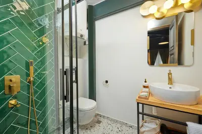 a bathroom with a sink and a toilet at Taksim Square - Unique Loft for 12 Guests in Istanbul