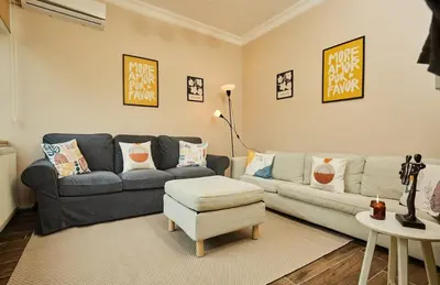 a living room with a couch and a chair at Stunning 3BR 3Bathroom 3AC near Metro D2 in Istanbul