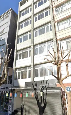 a tall white building with a tree in front of it at Stunning 3BR 3Bathroom 3AC near Metro D3 in Istanbul
