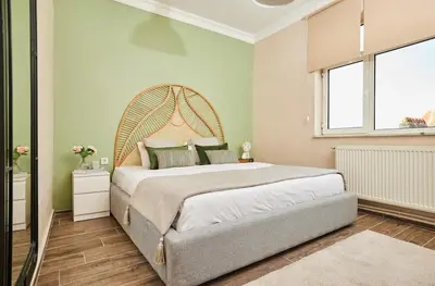 a bedroom with a large bed and a large window at Stunning 3BR 3Bathroom 3AC near Metro D5 in Istanbul