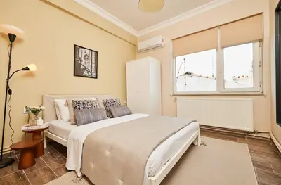 a bedroom with a large bed and a window at Stunning 3BR 3Bathroom 3AC near Metro D5 in Istanbul