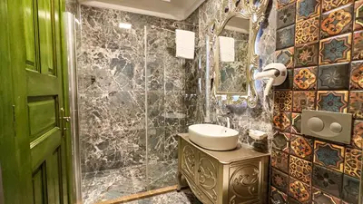 a bathroom with a sink and a mirror at Emerald Mansion Hotel in Istanbul