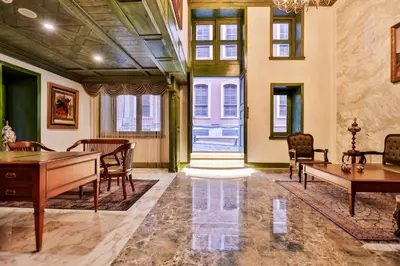 a living room with a table and chairs at Emerald Mansion Hotel in Istanbul