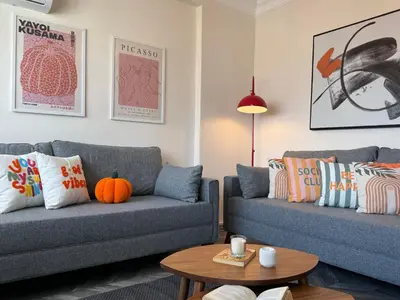 a living room with two couches and a table at Stunning 3BR 3Bathroom 3AC near Metro D6 in Istanbul