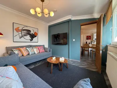 a living room with a couch and a table at Stunning 3BR 3Bathroom 3AC near Metro D6 in Istanbul