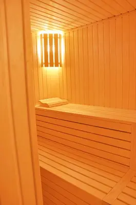 a wooden sauna with a light in the middle at Veyron Hotels & SPA in Istanbul