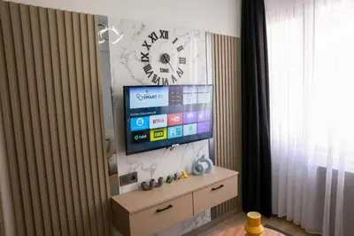 a living room with a tv on a wall at World Yours Luxury Suite - Beyoğlu in Istanbul