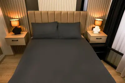 a bedroom with a large bed with two night stands at World Yours Luxury Suite - Beyoğlu in Istanbul