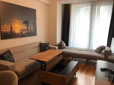 a living room with a couch and a coffee table at Sedef Suite in Istanbul