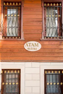 two windows on a building with a sign on it at Atam Suites in Istanbul