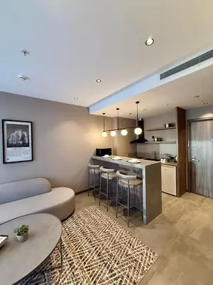 a kitchen and living room with a couch and a table at Cityloft 147 in Istanbul