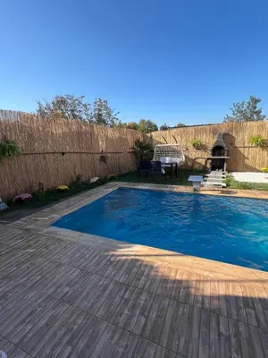 a backyard with a swimming pool and a wooden deck at DREAM DELUXE SAPANCa in Sapanca