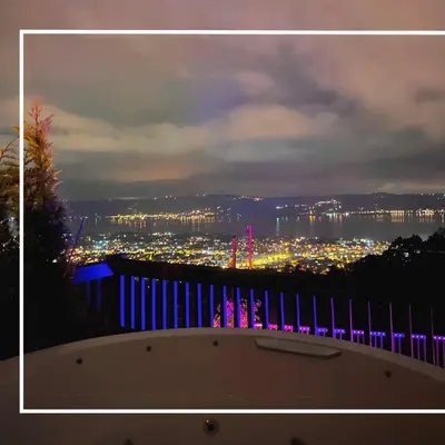 a view of a city from a balcony at night at Hill House Bungalov in Sapanca