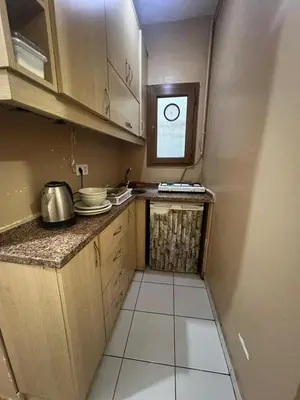 a small kitchen with a counter and a window at Taksim Luxury Mansion Hotel in Istanbul
