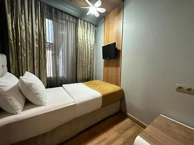 a hotel room with a bed and a window at My Dora Hotel in Istanbul