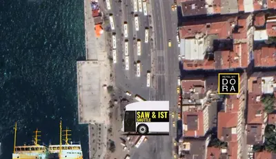 a white bus driving down a city street at My Dora Hotel in Istanbul