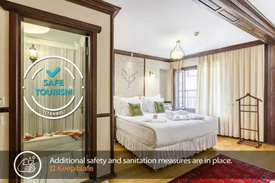 a hotel room with a bed and a window at Best Point Hotel Sultanahmet,Istanbul in Istanbul