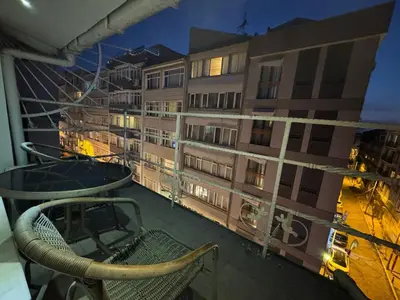 a balcony of a building with a table and chairs at The Şişli No Va Park Suites in Istanbul