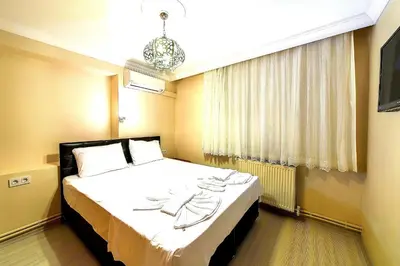 a hotel room with a bed in a room at Efe Apart Hotel in Istanbul