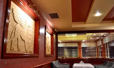 a dining room with a table and chairs and a window at Hotel Erden Sarayevo in Istanbul
