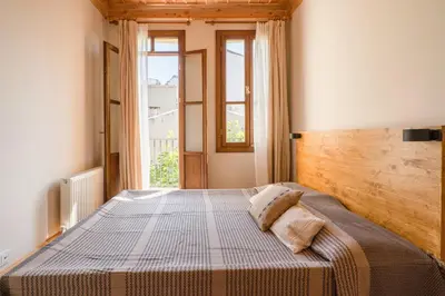 a bedroom with a large bed with a wooden headboard at Applehill in Istanbul