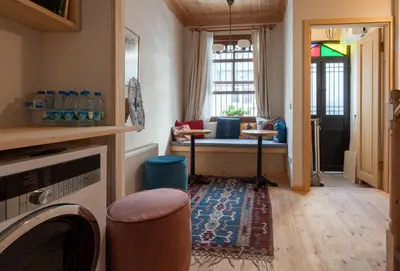 a living room with a couch and a window at Applehill in Istanbul