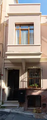 a house with a balcony and a window at Applehill in Istanbul