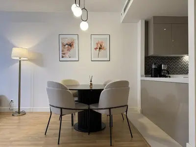 a dining room with a table and chairs at Taksim Petek Residence in Istanbul