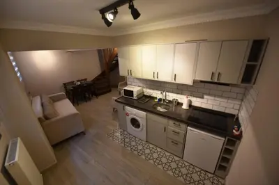 an overhead view of a kitchen with a sink and a microwave at A spacious 3 rooms duplex close to İstiklal Boulevard in Istanbul
