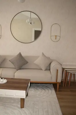 a living room with a couch and a mirror at Luxe Suite AY38 in Eskiömerler