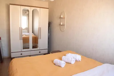 a bedroom with a bed with towels on it at Luxe Suite AY38 in Eskiömerler