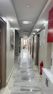 a hallway of a hospital with a long hallwayngth at Lions Boutique Hotel in Altınova