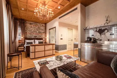 a living room with a couch and a table at Stone Inn Galata in Istanbul