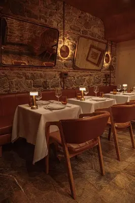a restaurant with tables and chairs with white table cloth at Stone Inn Galata in Istanbul