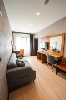 a living room with a couch and a desk at Educity Hotels & Spa in Istanbul